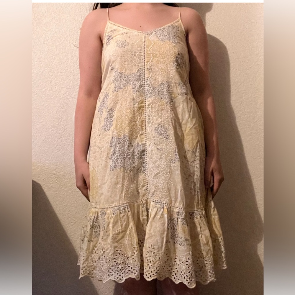 unlabeled 2000s sundress. mostly yellow and white with a grayish pattern.
